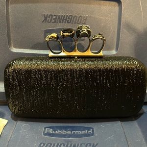 Brand-new black skull brass knuckle clutch